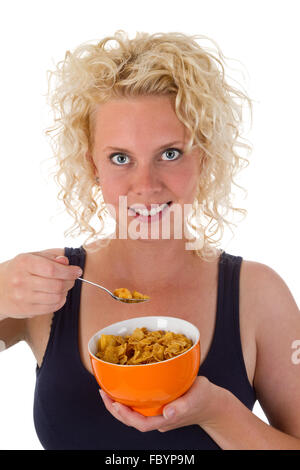 Junge Frau Essen cornflakes Stockfoto