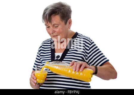 Ältere Frau mit Orangensaft Stockfoto