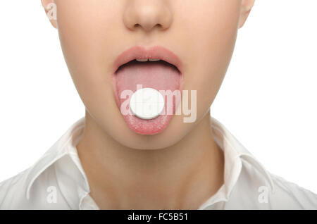 Großen Tablette auf der Zunge Frauen Stockfoto