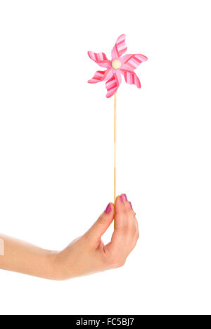 Hand mit Spielzeug Wetterfahne Stockfoto
