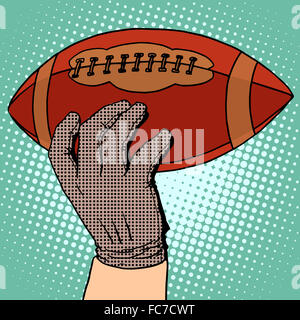 Die Kugel des American Football in der hand Stockfoto