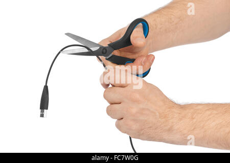 Hand mit Schere und Computer Kabel Stockfoto