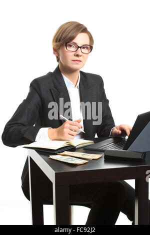 Mädchen will budget. Dollar, sagte. Sie zählt Geld am Tisch Stockfoto