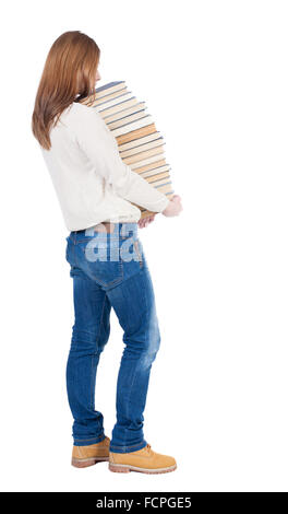 Eine Mädchen trägt einen schweren Stapel Bücher. hinten Sie Ansicht von. Hintere Ansicht Menschen Sammlung. Rückseite Blick auf Person. Isoliert auf weißem Hintergrund. Stockfoto