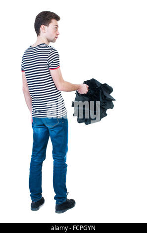Rückansicht des Mannes in Jeans mit Regenschirm. Stehender junger Mann. Hintere Ansicht Menschen Sammlung. Rückseite Blick auf Person. Isoliert auf weißem Hintergrund. Der Mann im gestreiften Hemd deckt das Dach Stockfoto
