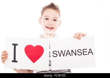 Junge mit Swansea Ortsschild Stockfoto