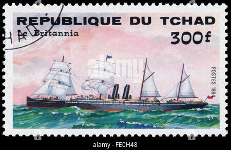 Republik Tschad - CIRCA 1984: eine Briefmarke gedruckt in Republik Tschad zeigt das Schiff 'Le Britannia' Stockfoto