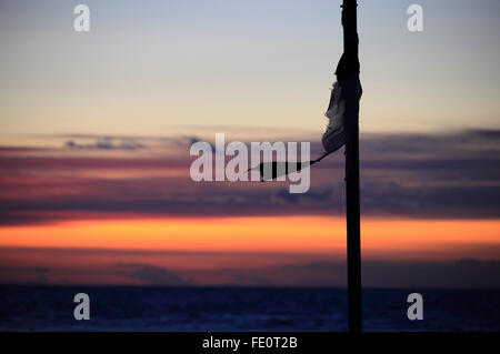 Heacham, Norfolk, Großbritannien. 3. Februar 2016. Großbritannien Wetter: Sonnenuntergang am Heacham. Bildnachweis: Stuart Aylmer/Alamy Live-Nachrichten Stockfoto