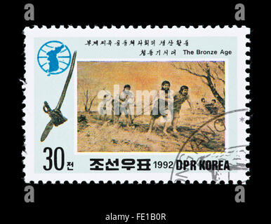Briefmarke aus Nordkorea Darstellung Pflügen. Stockfoto