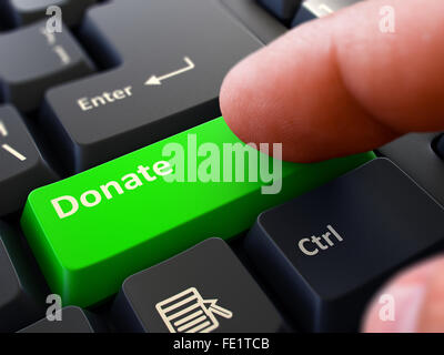 Drücken Sie die Taste Spenden auf schwarzen Tastatur. Stockfoto