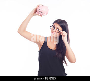 Junge Frau mit einem Sparschwein sorgen Stockfoto