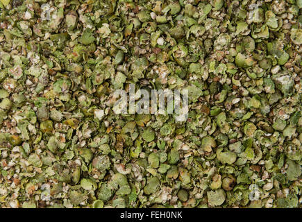 Zerdrückte grüne Pfefferkörner für als Hintergrundbild oder als Textur verwenden Stockfoto