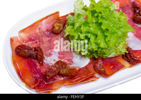 Traditionellen spanischen Schinken (Jamon) in weißer Teller, Nahaufnahme Stockfoto