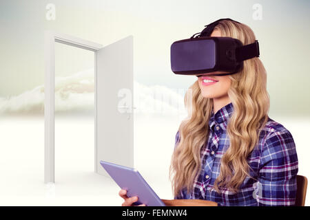Zusammengesetztes Bild ziemlich lässig Arbeitnehmers mit Oculus rift Stockfoto