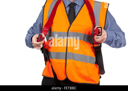 Gebäude Landvermesser in orange Sichtbarkeit Weste anziehen Sicherheitsgurt Stockfoto