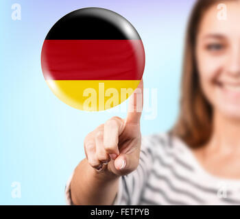 Frau-Punkt auf die Blase mit deutscher Flagge Stockfoto