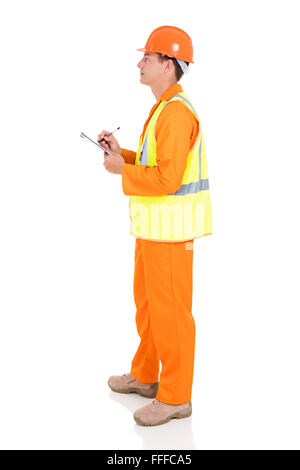 Seitenansicht des jungen männlichen Elektriker in Zwischenablage schreiben Stockfoto