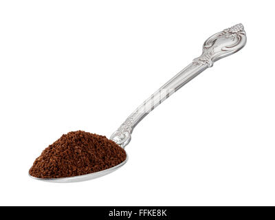 Messlöffel Kaffeepulver in einem Löffel. Das Bild zeigt einen Ausschnitt isoliert auf einem weißen Hintergrund. Stockfoto