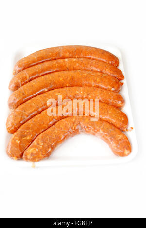 Hot and Spicy Fleischwurst Over White Stockfoto