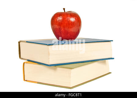 Zwei Bücher und ein Apfel Stockfoto