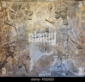 Reliefschnitzen paar Schutzgeister aus dem Süd-West-Palast in Ninive, assyrischen Gallery, British Museum, London, UK Stockfoto