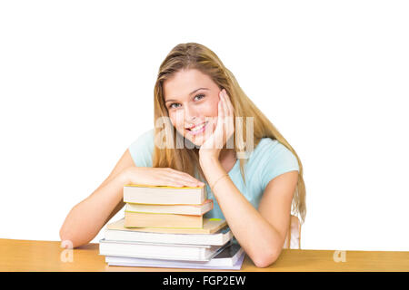 Zusammengesetztes Bild des Porträts von Studentin in der Bibliothek Stockfoto