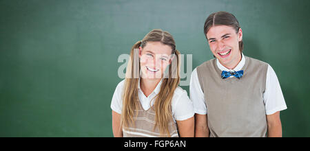 Zusammengesetztes Bild des Lächelns geeky Hipster Blick in die Kamera Stockfoto