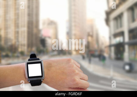 Zusammengesetztes Bild der Smartwatch am Handgelenk Stockfoto