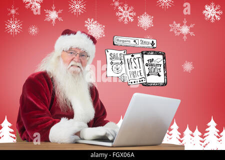 Zusammengesetztes Bild von Santa surft im Internet Stockfoto