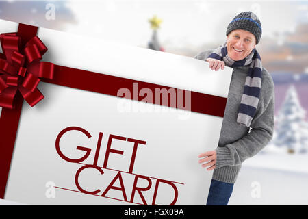 Zusammengesetztes Bild Winter paar zeigt Poster Stockfoto