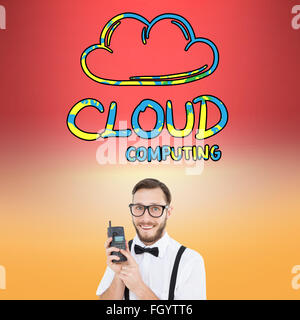 Zusammengesetztes Bild geeky Hipster hält ein Retro-Handy Stockfoto