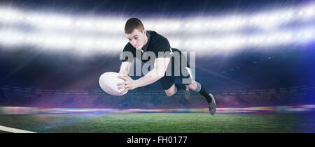Zusammengesetztes Bild ein Rugby-Spieler, erzielte einen Versuch Stockfoto