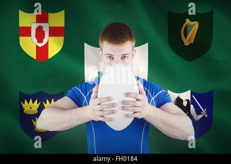 Zusammengesetztes Bild des Rugby-Spieler mit Rugby-ball Stockfoto