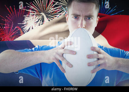 Zusammengesetztes Bild des Rugby-Spieler mit einem Rugby-ball Stockfoto