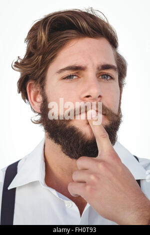 Porträt von Hipster mit Finger am Kinn Stockfoto