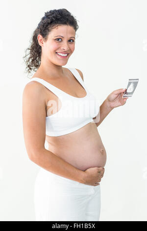 Schwangere Frau mit einer Ultraschalluntersuchung Stockfoto