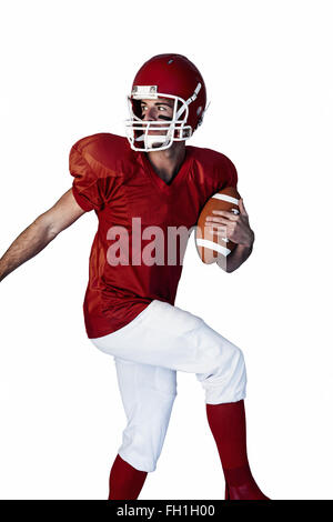 Rugby-Spieler hält den Ball und ein Blick hinter Stockfoto