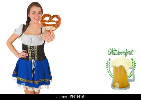 Zusammengesetztes Bild von hübschen Oktoberfest Mädchen halten Brezel Stockfoto