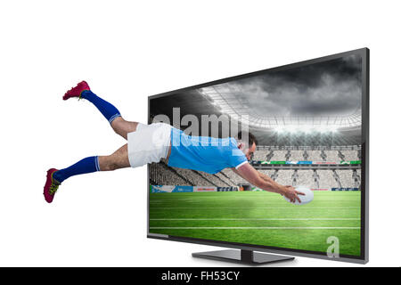 Zusammengesetztes Bild des Rugby-Spieler, erzielte einen Versuch Stockfoto