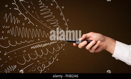 Hand mit Fernbedienung und geschweiften Linien Stockfoto