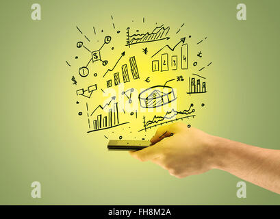 Verkaufs-Charts auf Handy in der hand Stockfoto