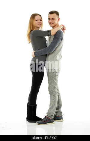 Glücklich Teenager-Paar in voller Länge auf weißem Hintergrund Stockfoto