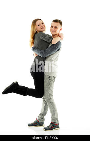 Glücklich Teenager-Paar in voller Länge auf weißem Hintergrund Stockfoto