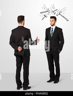 Unternehmer, die eine Waffe versteckt Stockfoto