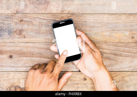 des Mannes Hand mit weißen Telefonbildschirm Draufsicht Stockfoto