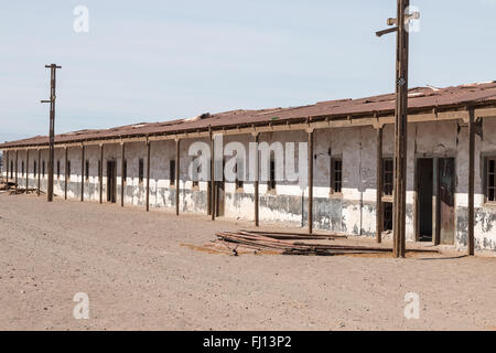 Leeren Straßen von verlassenen Häusern in humberstone Ghost Town, ein ehemaliger Nitrat Gewinnung und Verarbeitung von Stadt in der Atacama Wüste. Stockfoto