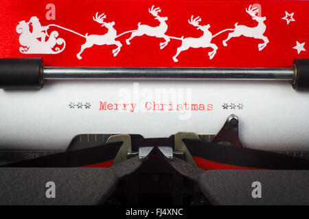 "Frohe Weihnachten" Wort auf Schreibmaschine Stockfoto