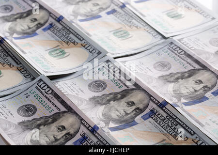 Hundert Dollar anhäufen als Hintergrund. Stockfoto