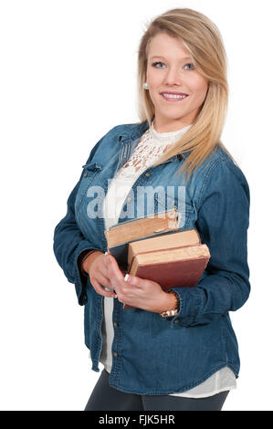 Schöne Frau mit einer Reihe von Büchern aus der Bibliothek Stockfoto