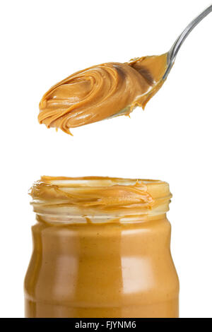 Glas und Löffel crunchy Erdnussbutter Stockfoto